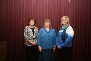 At the February meeting, Renee Taylor (l), chapter vice president for special projects, recognizes Robin Collins (c) of Midwest City High School and Tamra Torres of Carl Albert Middle School for receiving Excellence in Science and Mathematics Teaching awards. 